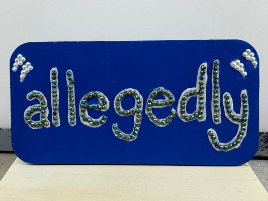 Allegedly Table top/shelf sign